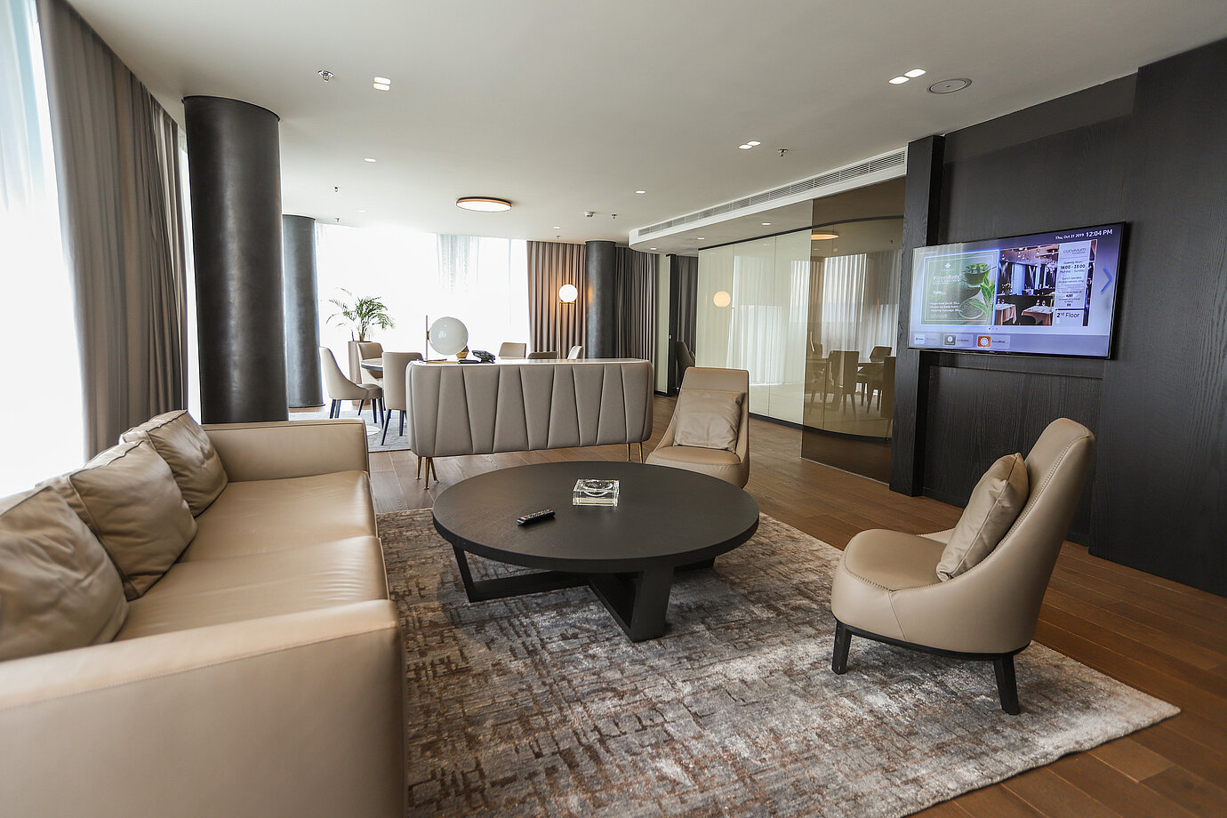 Elegant lounge area with leather sofas and armchairs at Maritim Hotel Plaza Tirana