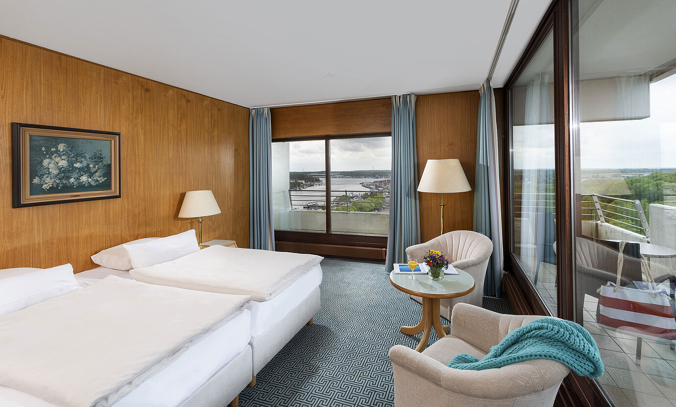 Double room with panoramic windows and view of Travemünde harbour at the Maritim Hotel