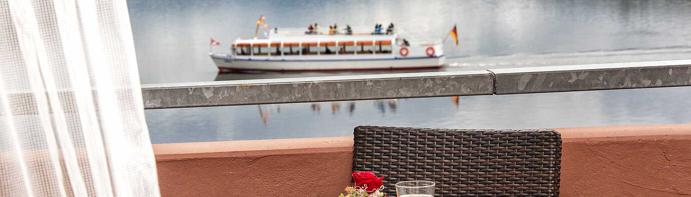 Balcony with lake view and passing boat on Lake Titisee at Maritim TitiseeHotel