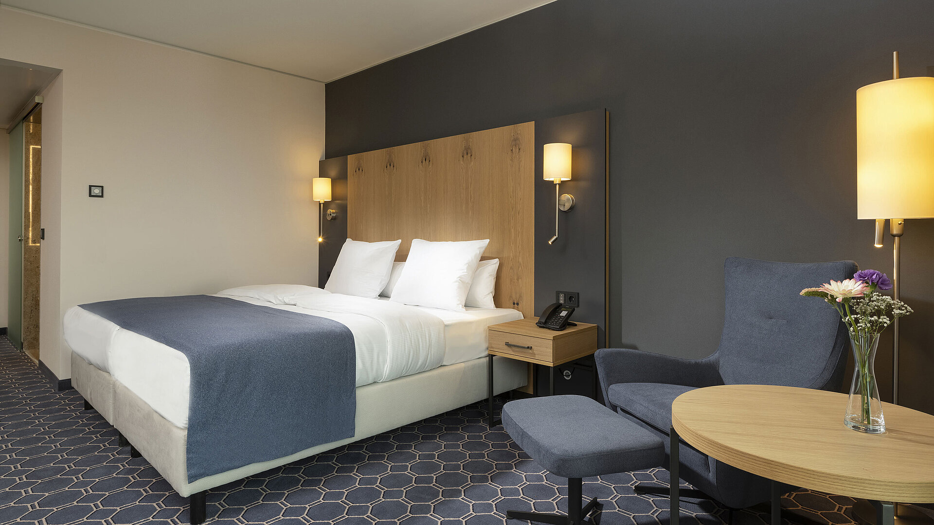 Superior room Modern double room at Maritim Hotel Ingolstadt with a cozy bed, elegant lighting, and stylish furnishings.