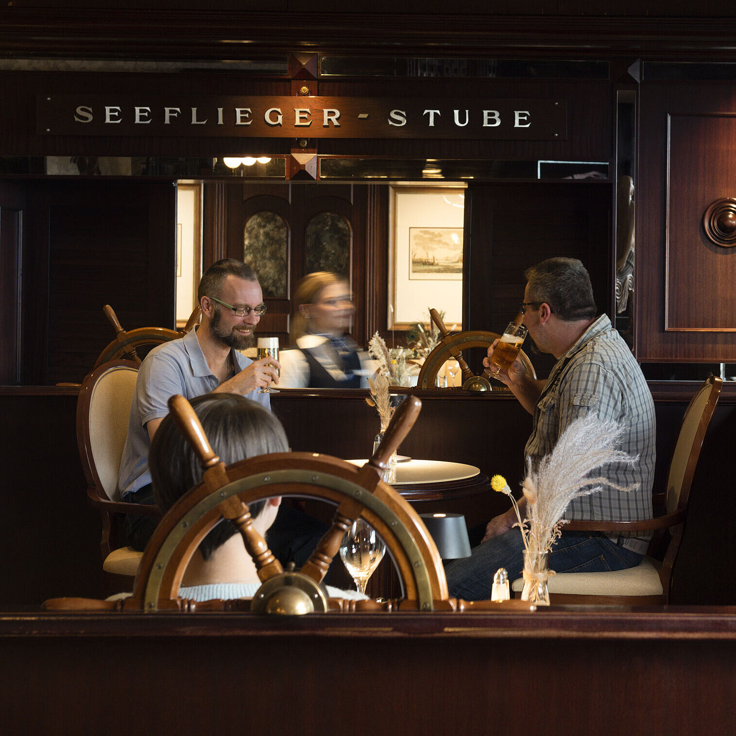 	Cosy Seeflieger-Stube at Maritim Hotel Travemünde with nautical details