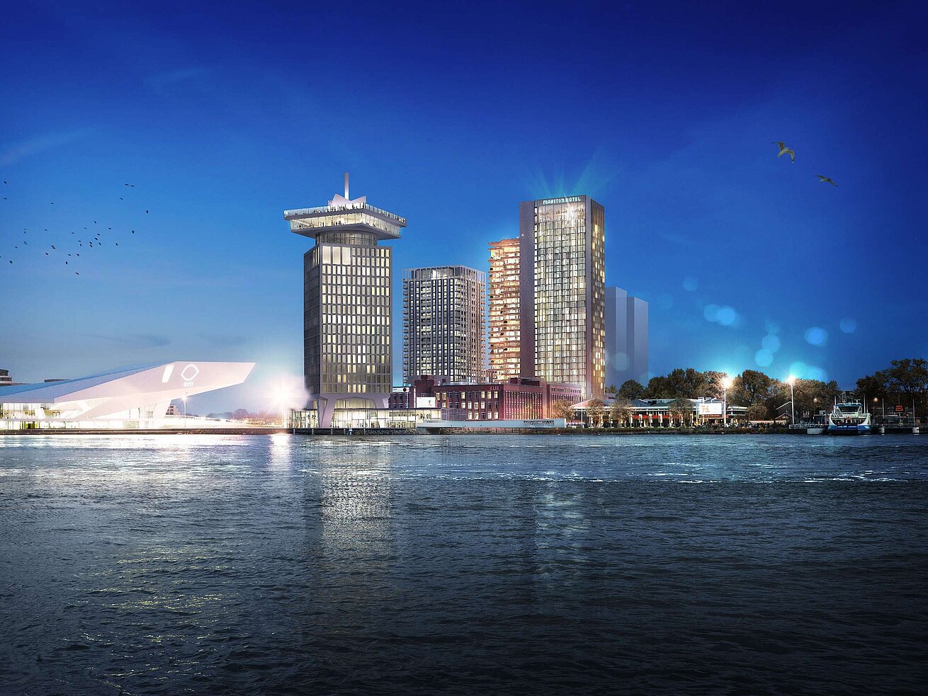 Exterior view Maritim Hotel Amsterdam at night with skyline view and the IJ river