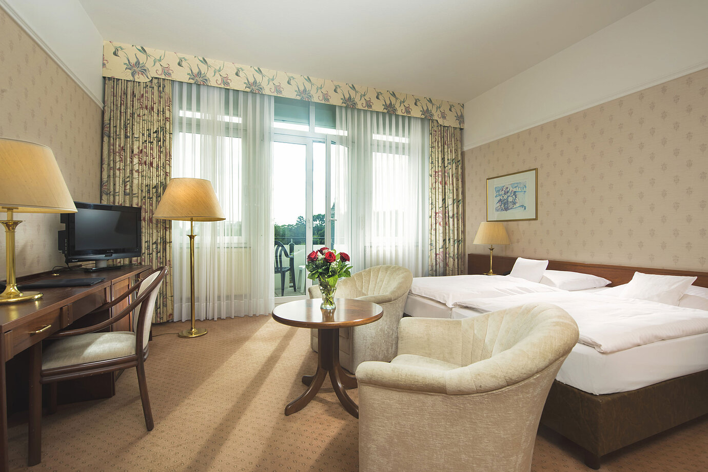 Bright double room with terrace access and sitting area at Maritim Hotel Bad Wildungen