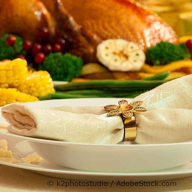 Festive roast goose with side dishes served on a table for enjoying at home