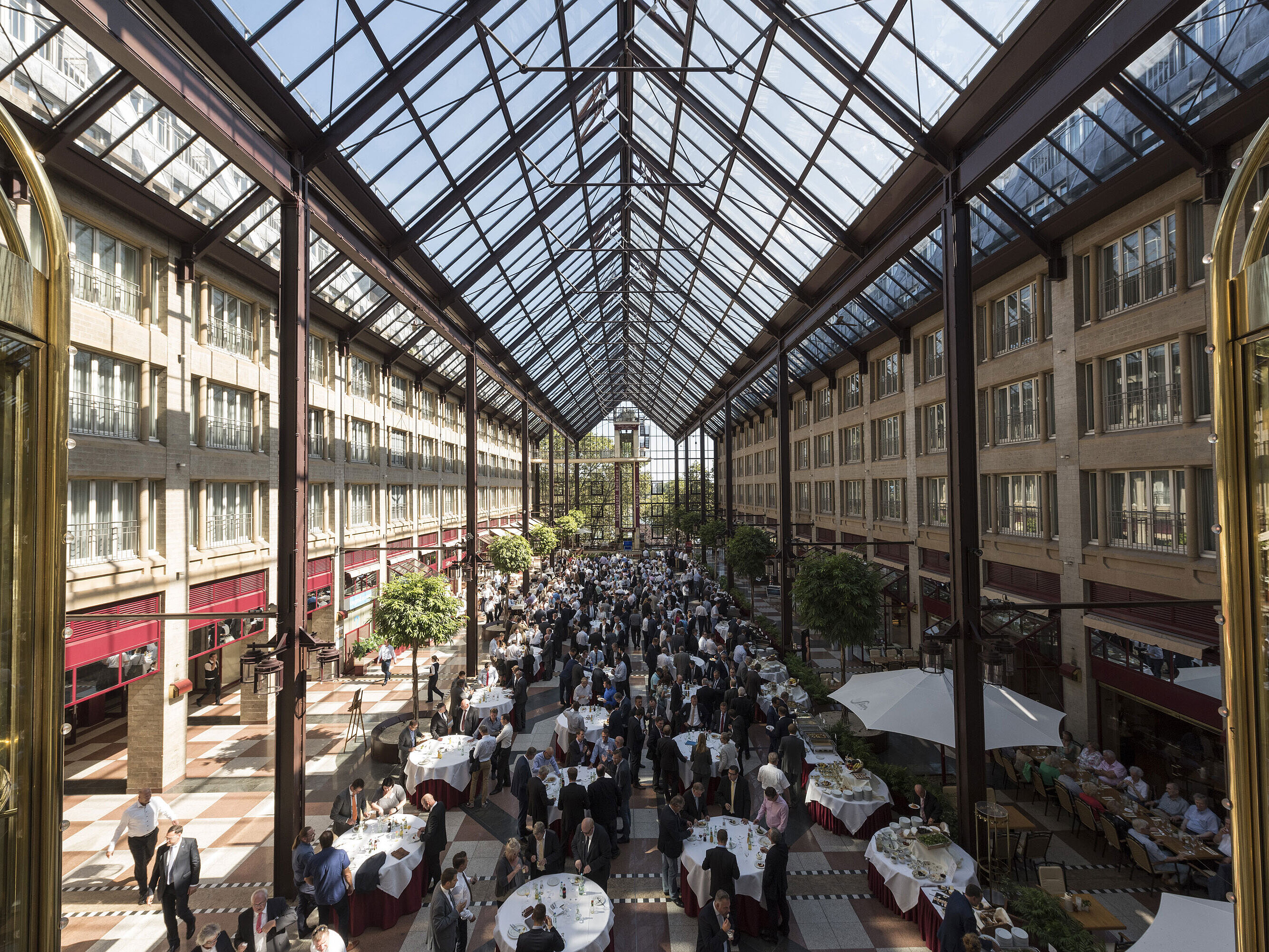 The elegant glass gallery at Maritim Cologne, perfect for large events and functions with natural light and urban ambiance.