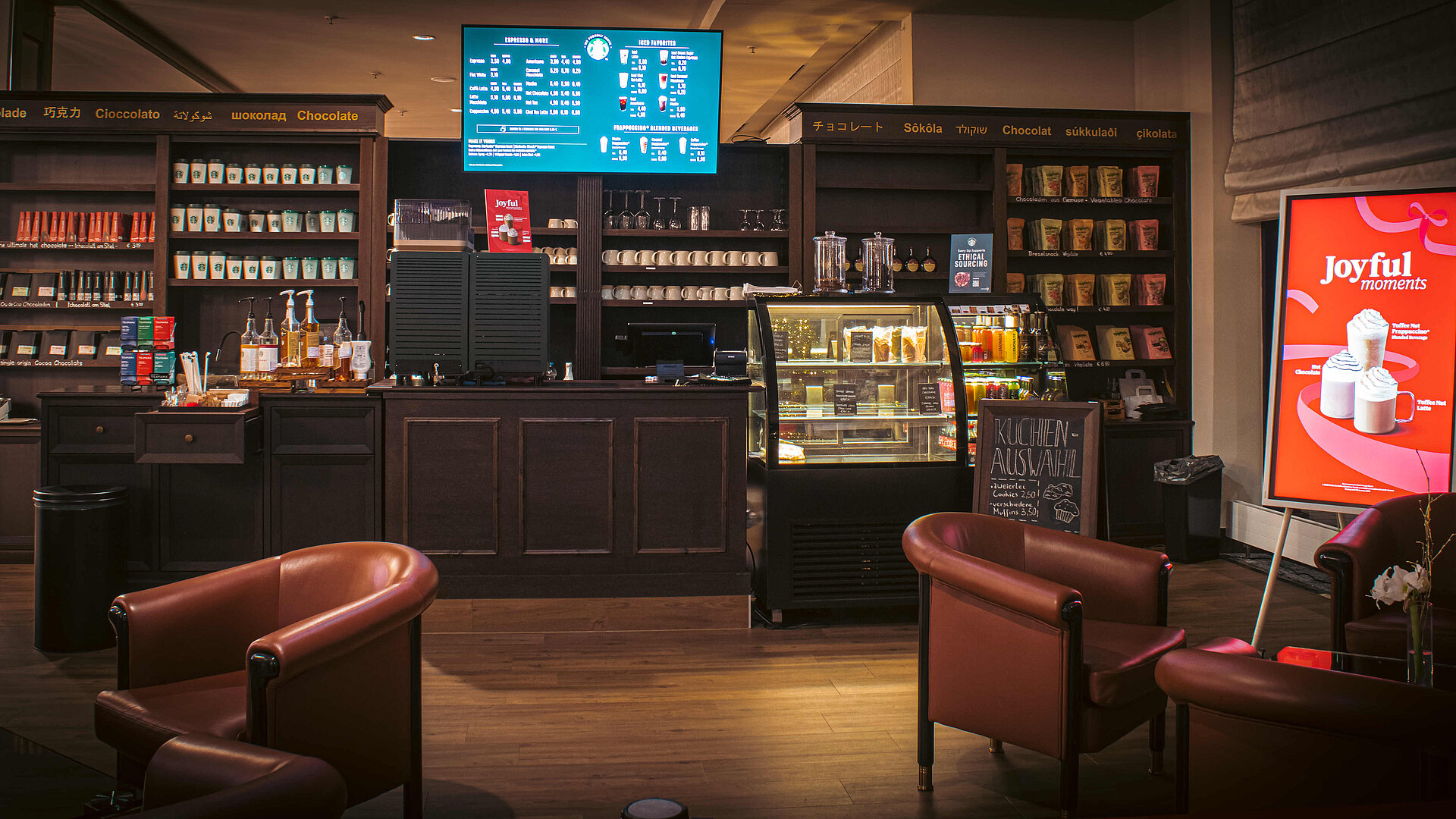 Café at the Maritim Hotel Bonn with Starbucks coffee, snack counter, cake display and cosy seating in a modern setting