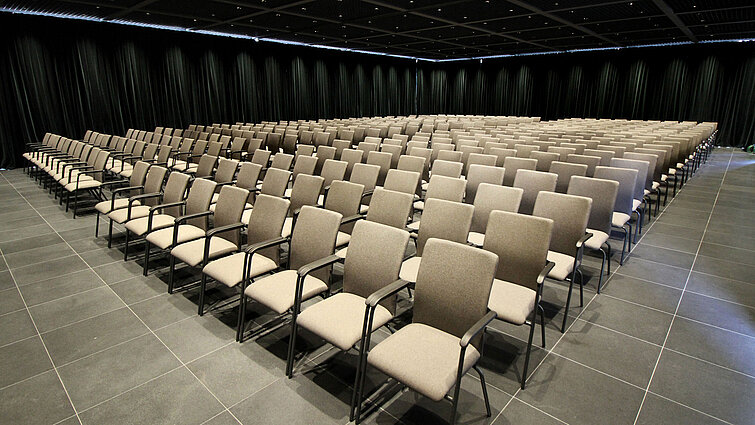 Large conference hall with row seating and stage view at Maritim Hotel Plaza Tirana