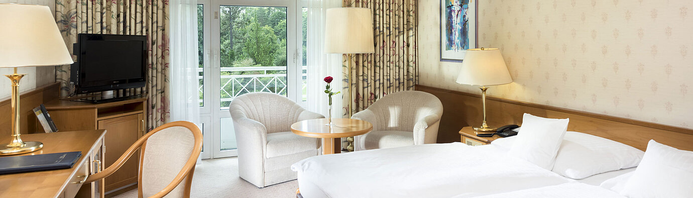 Comfort room  Bright double room with balcony view and seating area at Maritim Hotel Bad Wildungen