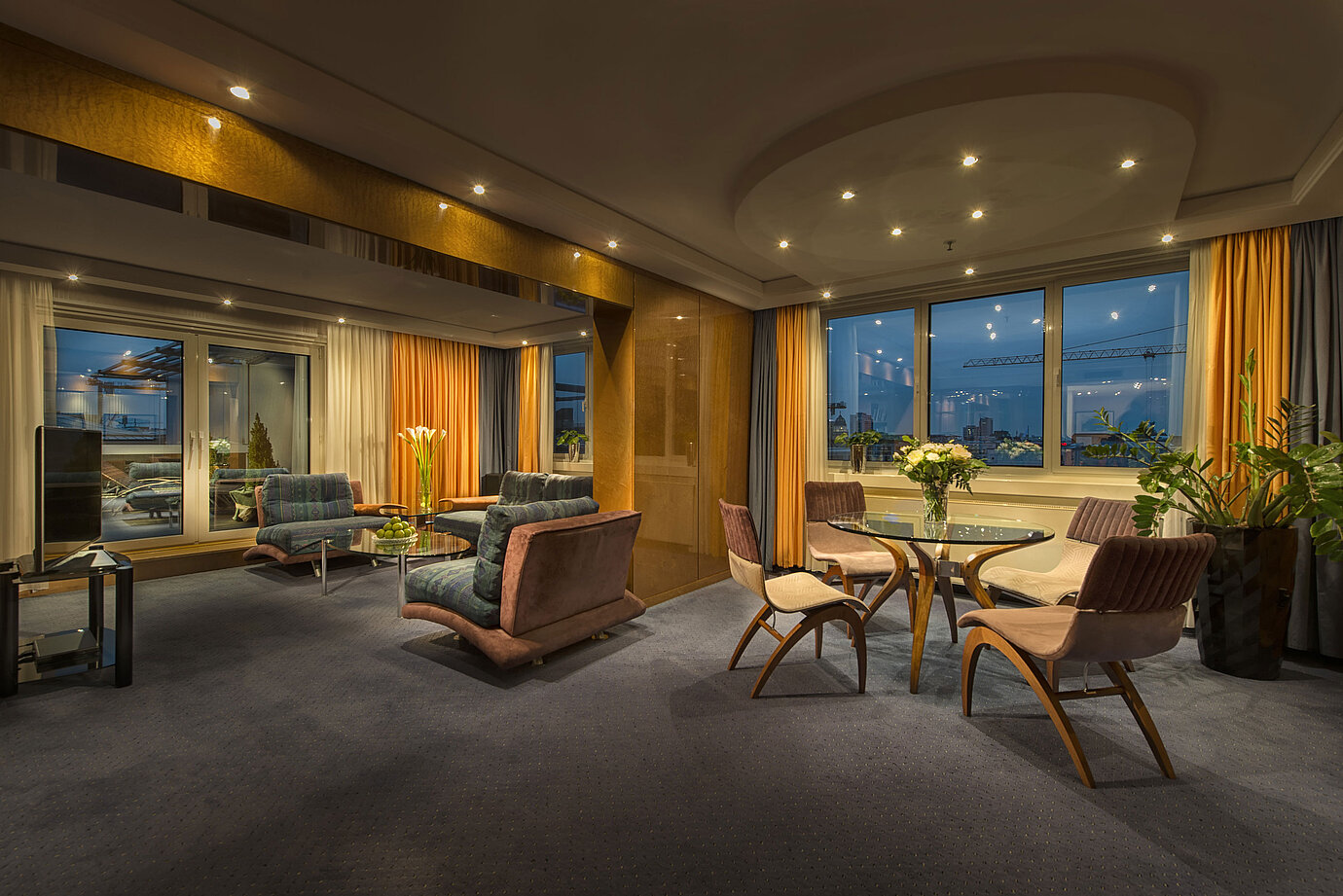 Elegant living room in the Presidential Suite at Maritim proArte Hotel Berlin with stylish lighting and view.