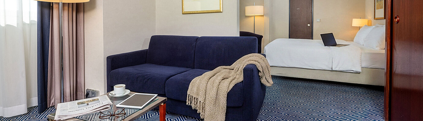 Classic Family room at Maritim Hotel Würzburg with sofa bed, double bed and stylish interior