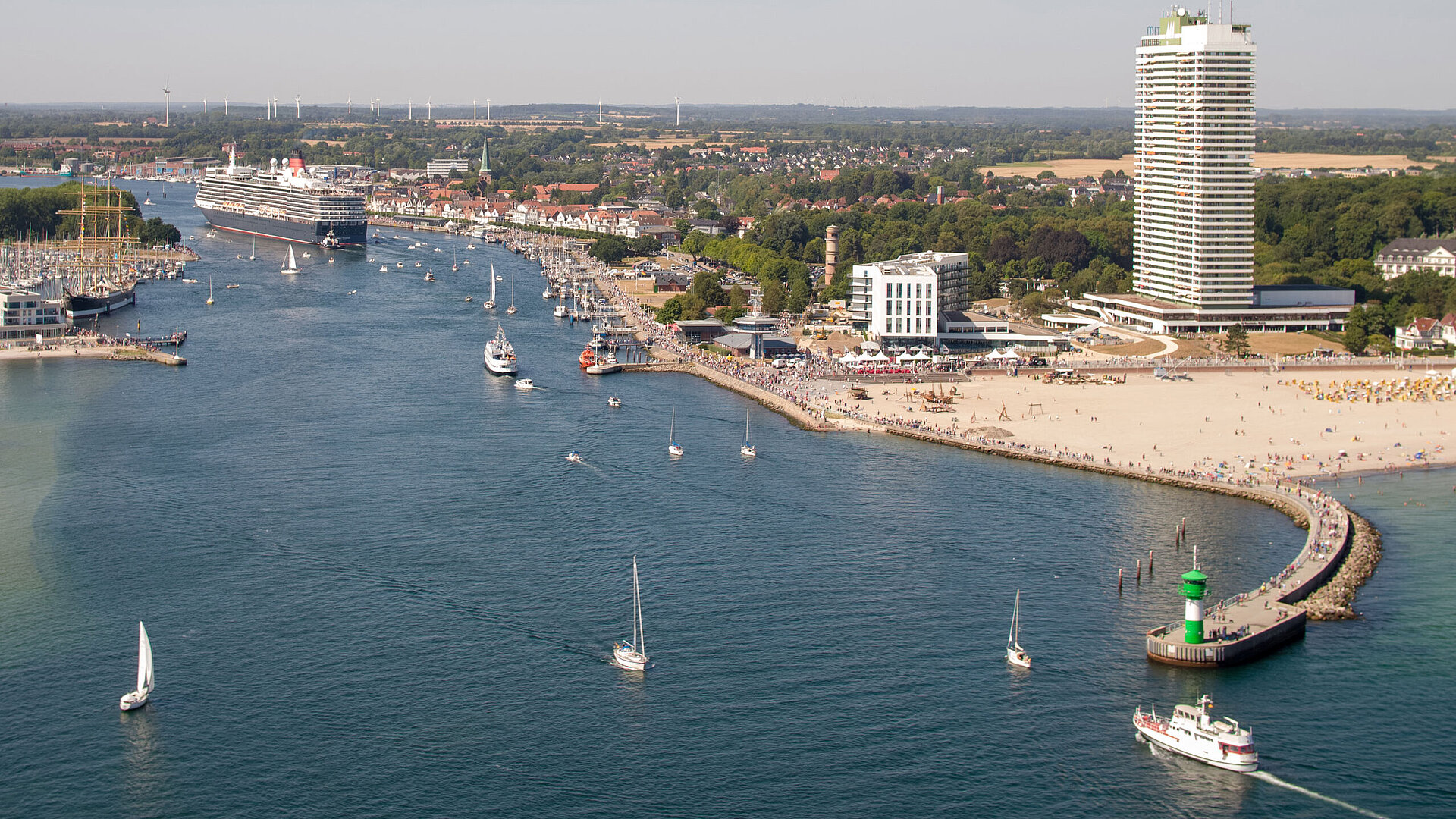 Aerial view of Travemünde with cruise ship, promenade and Maritim Hotel by the Baltic Sea