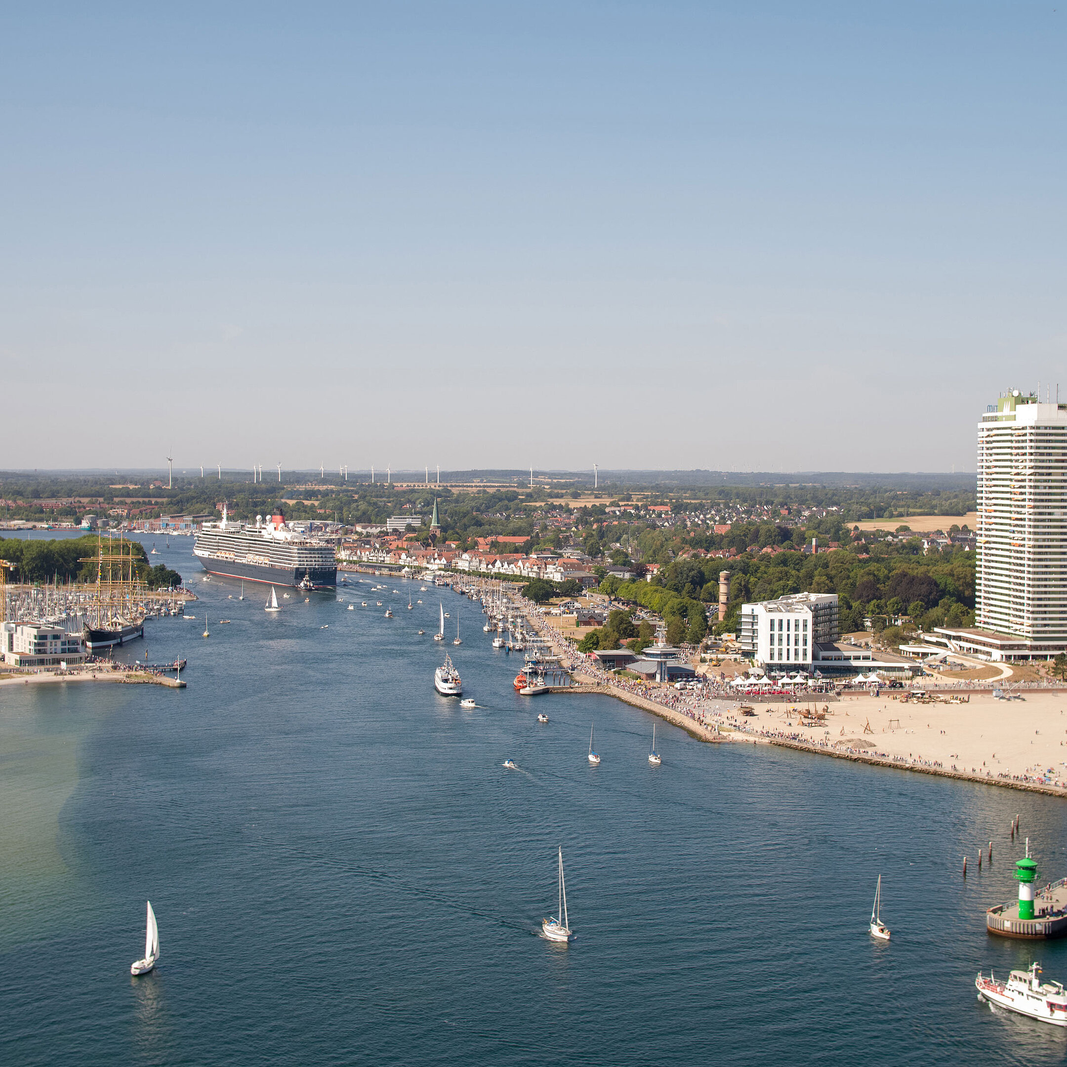 Aerial view of Travemünde with cruise ship, promenade and Maritim Hotel by the Baltic Sea