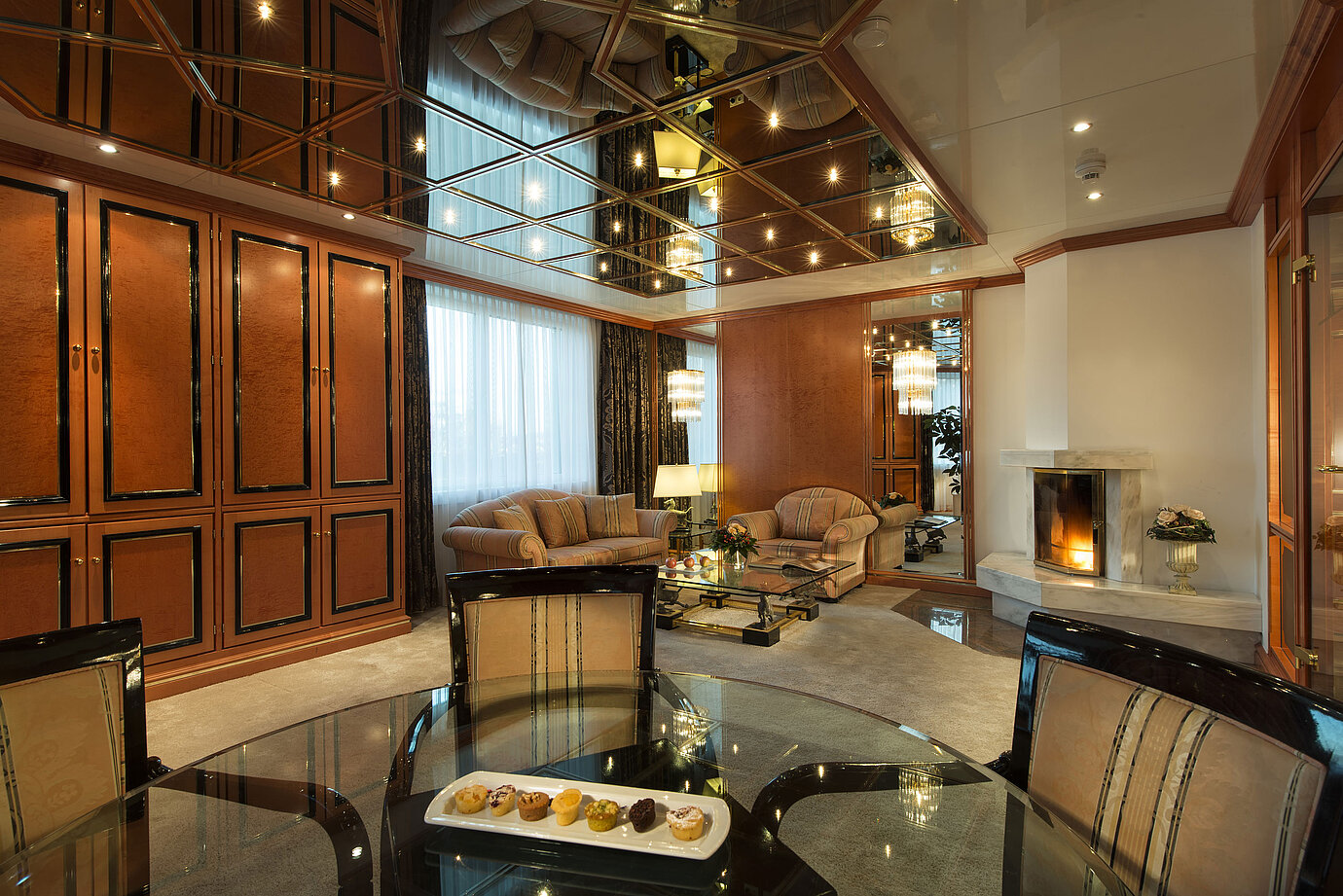 Exclusive presidential suite with elegant decor, fireplace and lounge at the Maritim Hotel Stuttgart