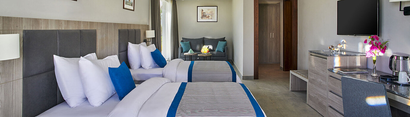 Sport Area Deluxe Room Modern family room at Maritim Jolie Ville Resort & Casino Sharm El Sheikh with two double beds