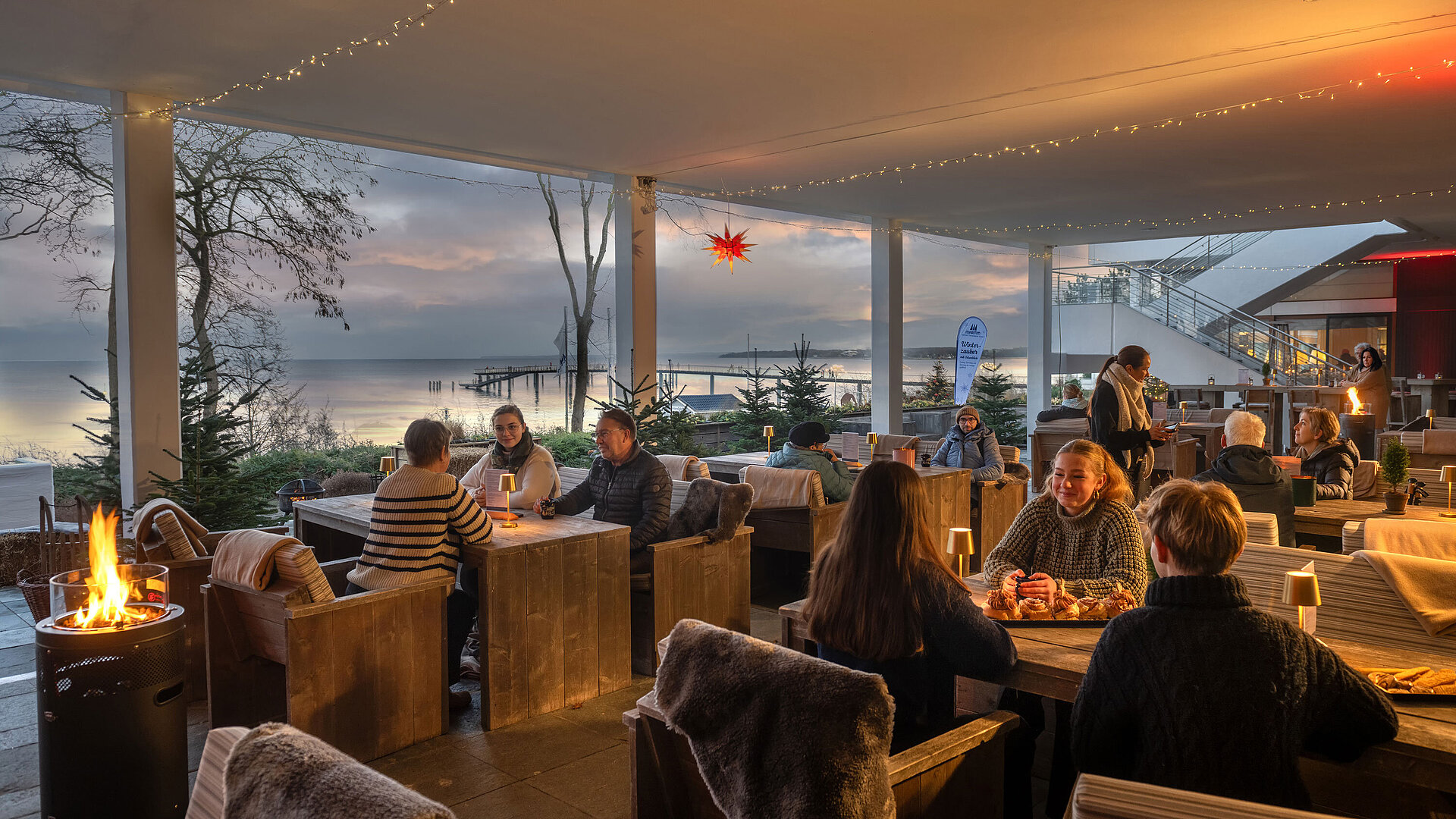 Winter magic by the Baltic Sea Festively decorated terrace area with candlelight, winter decorations and views of the Baltic Sea.