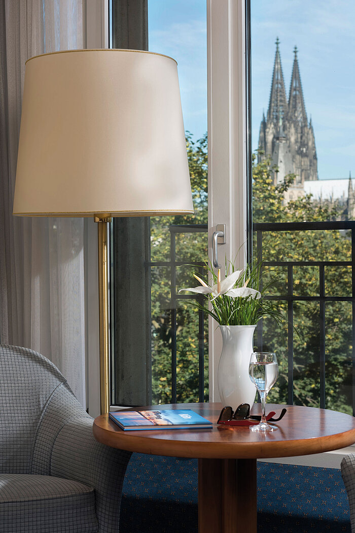 Superior double room at Maritim Hotel Cologne with elegant decor and view of the Cologne Cathedral.